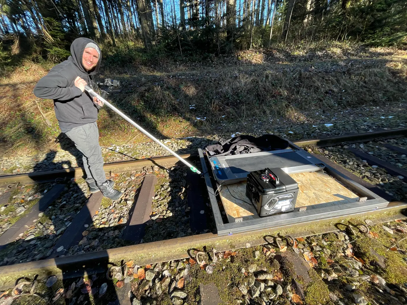 The finished trolley on the railway line, with the treadmill and the generator on its chipboard floor